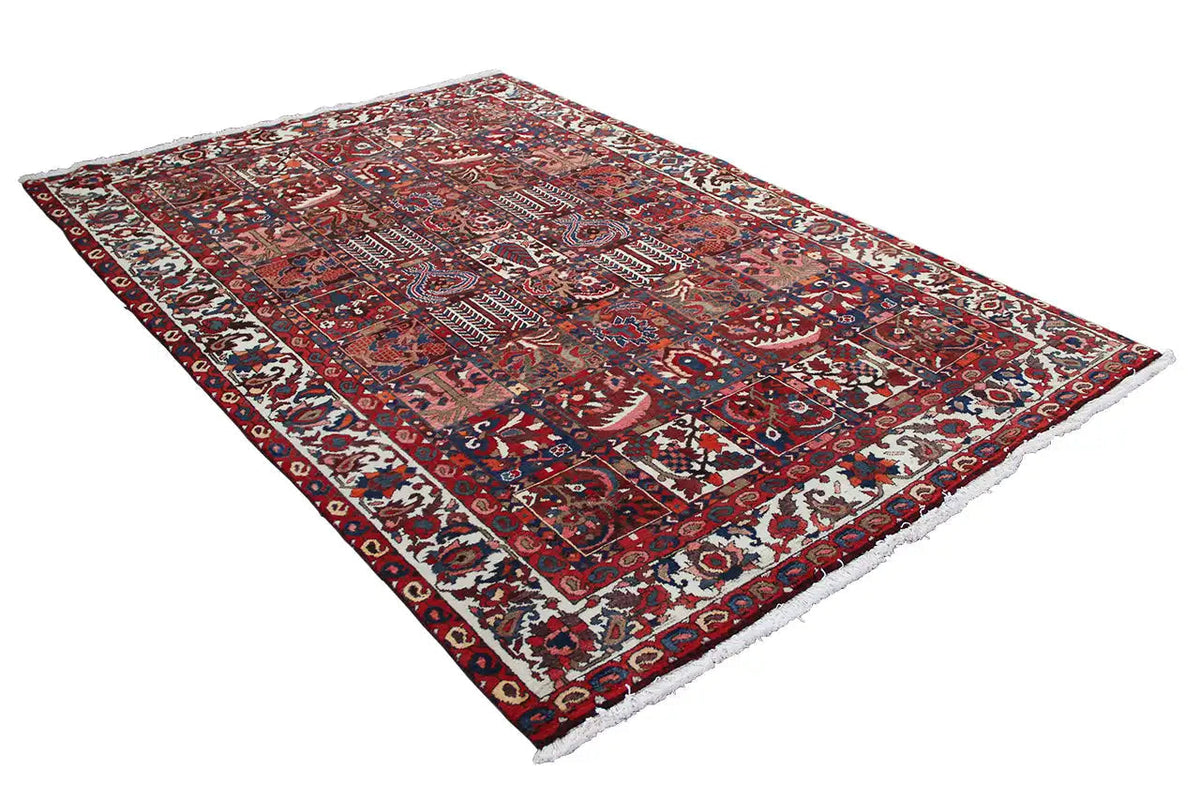 Tapete Bakhtiari 303x205 cm com ornamentos em forma de estrela em vermelho, azul e creme