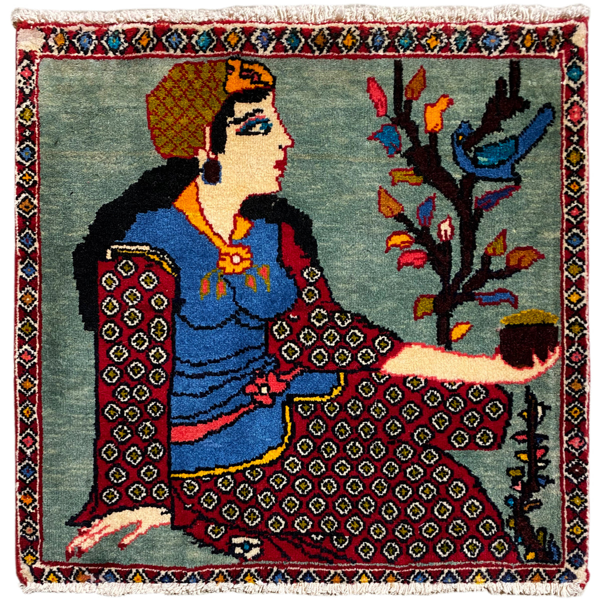 Tapete Poshti 68x63 cm com figura, motivo de árvore, bordadura multicolorida e franjas