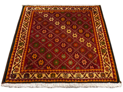 Tapete Poshti, retangular, multicolorido, com borda decorativa e franjas nas extremidades.
