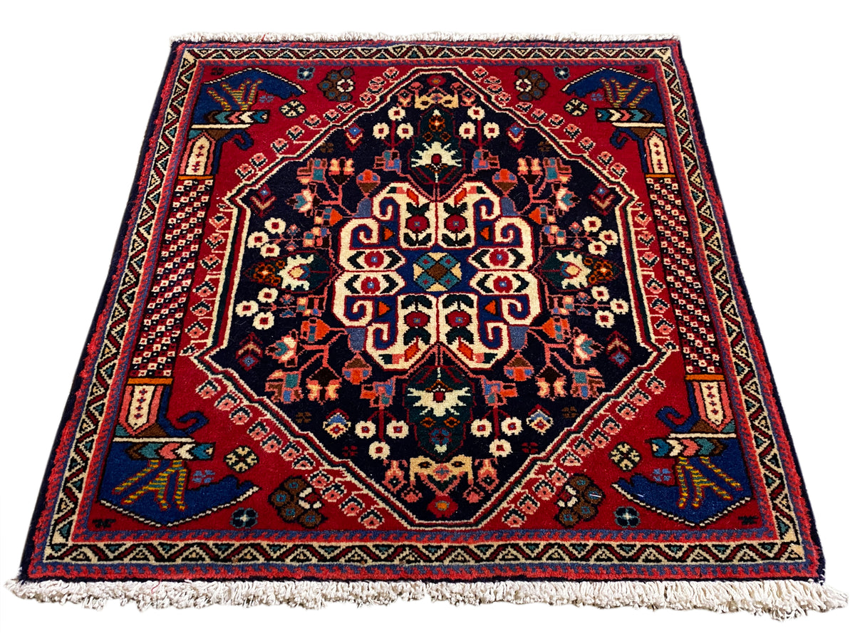 Tapete Poshti 66x63 cm, azul-escuro/vermelho, padrão de medalhão com franjas nas extremidades